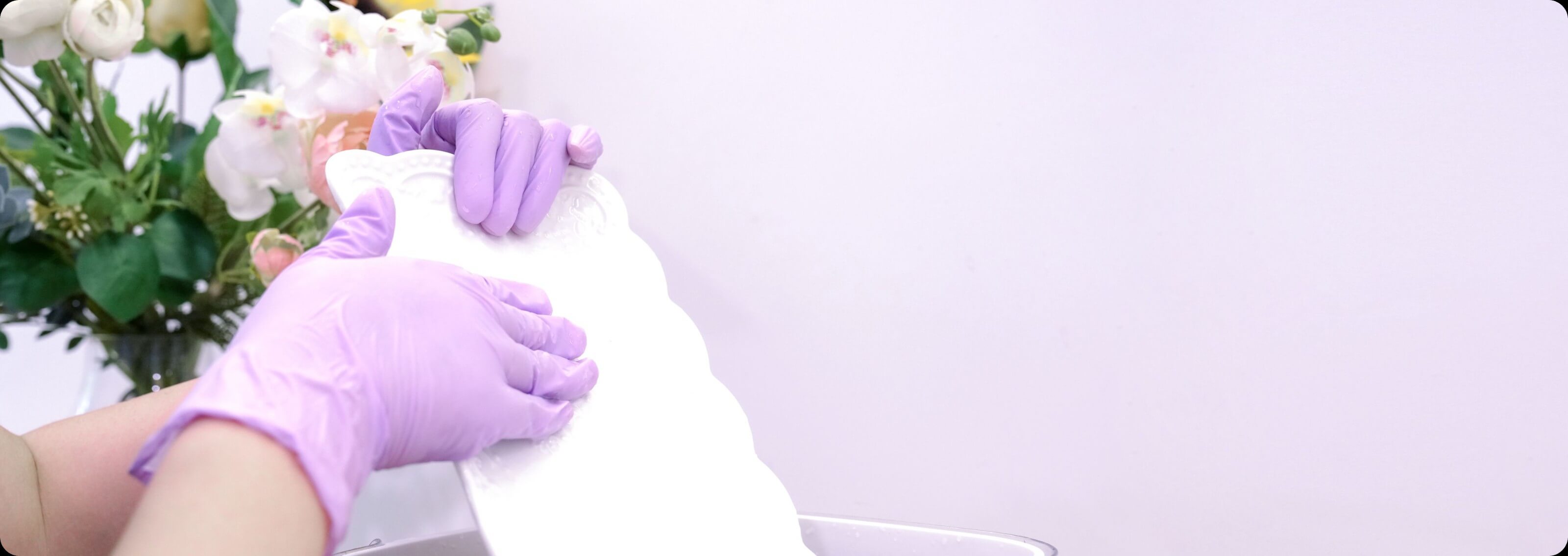 Synmax Ultra Vinyl glove with orchid arrangement