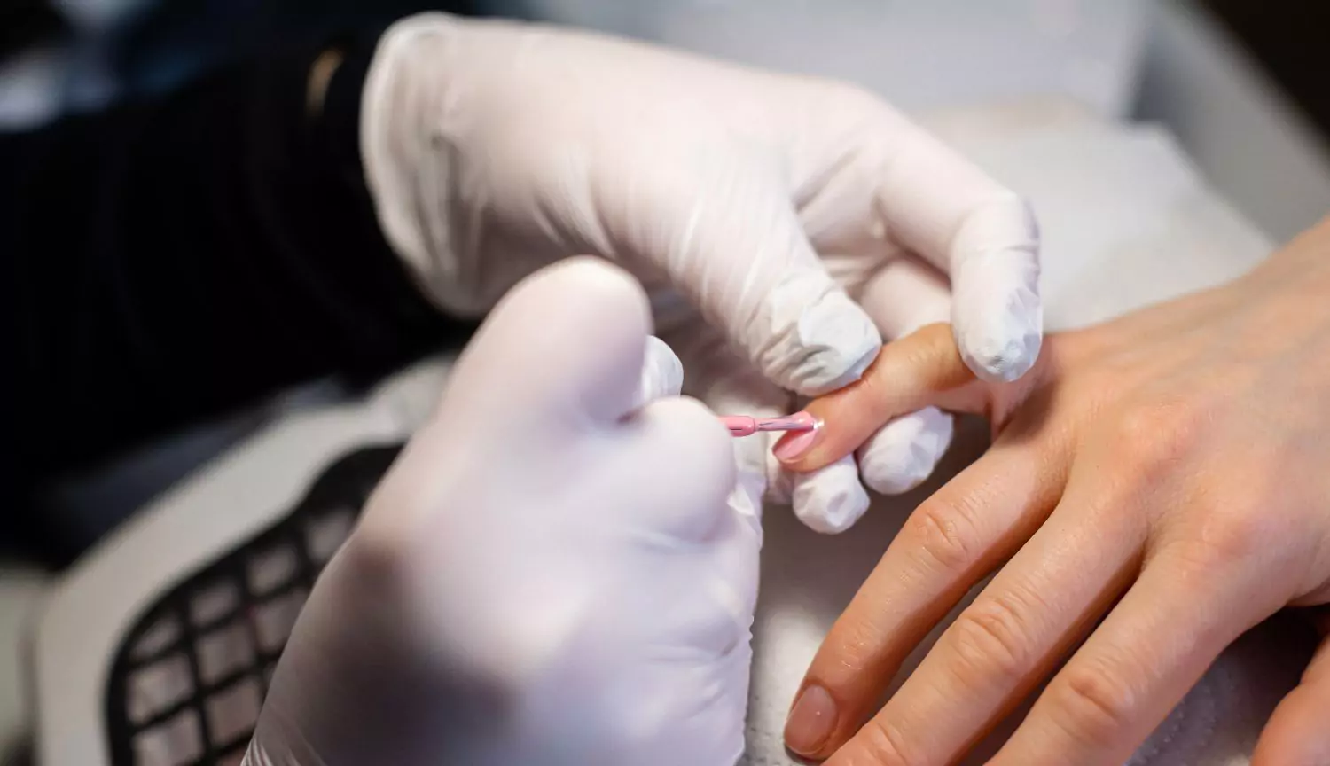 Synthetic latex gloves used during professional manicure service
