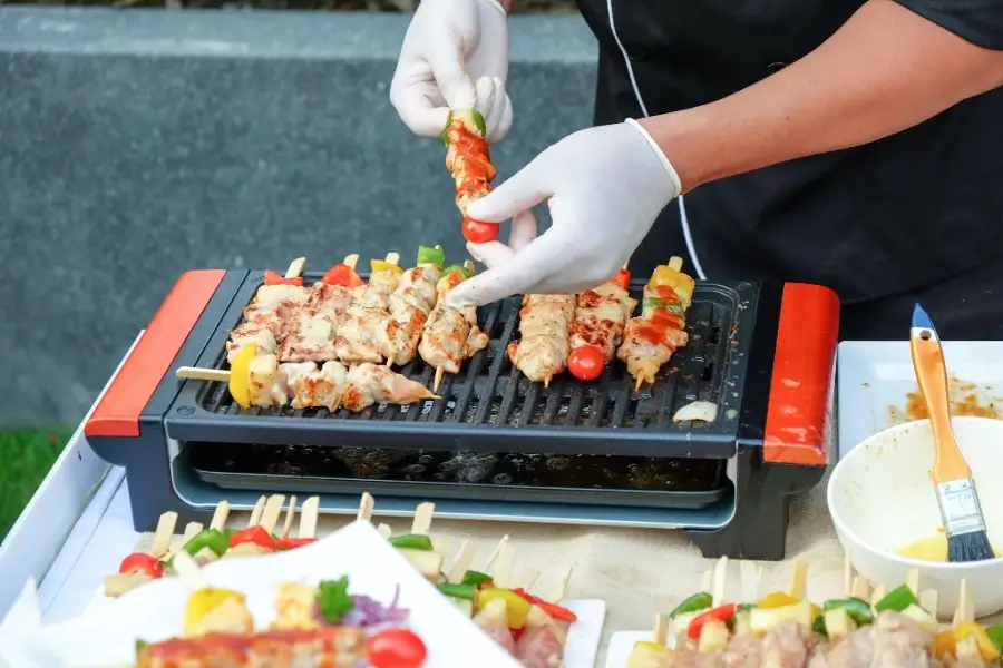 BBQ Gloves for Safe Handling of Skewers on the Grill During Outdoor Cooking