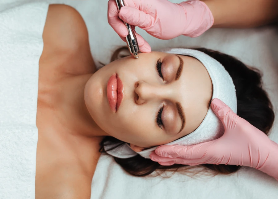 Disposable Pink Gloves used in facial treatment sessions for hygienic care.