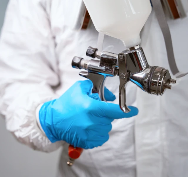 Industrial protection gloves used in painting and coating operations for surface preparation, material application, and handling of paints and coatings.